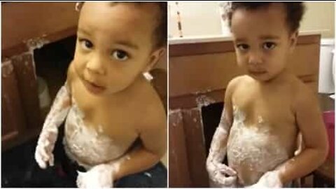 Little boy covers himself in hair cream