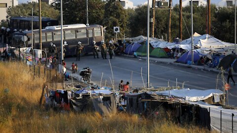 Greek Authorities Move Migrants To New Camp After Fires