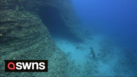 Freediver explores the infamous shipwrecks and underwater caves of Hawaii