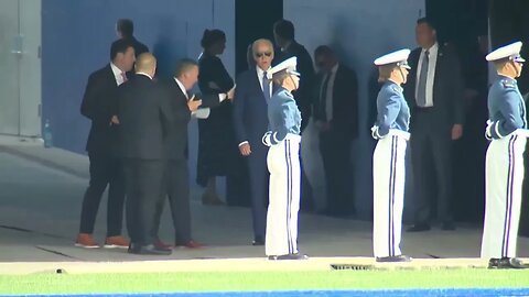 A Staffer Physically Pushes Joe Biden Onto Field At Air Force Graduation Ceremony