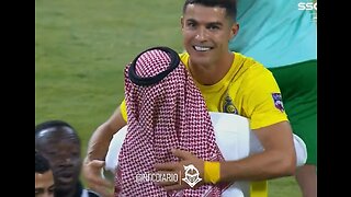 Cristiano Ronaldo hugs the president of Al Nasr after he helped his team win the Arab Cup
