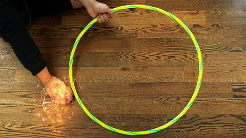 Wrap string light around a hula hoop for this GORGEOUS lighting idea!