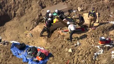 Crews rescue man stuck in waist-deep mud