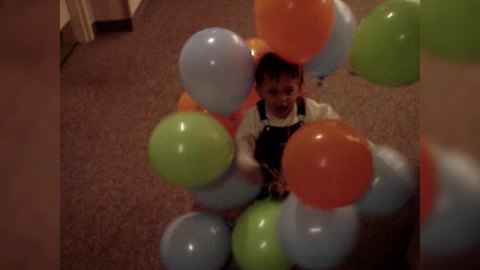 Precious Boy Carries Balloons