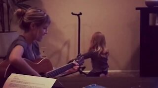Little girl with angelic voice sings with her mommy