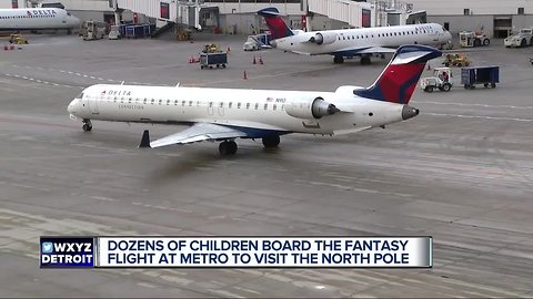 Dozens of children board fantasy flight to North Pole