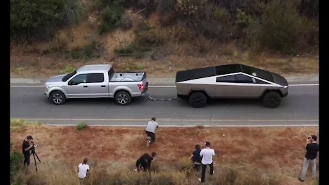 Cyber Truck Pulls F-150 up hill in one minute