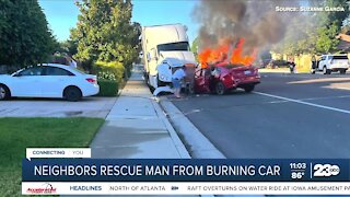 Neighbors rescue man from burning car