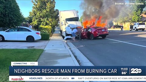 Neighbors rescue man from burning car