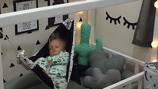 Comfy Baby Sleeps Peacefully In Bedroom Hammock