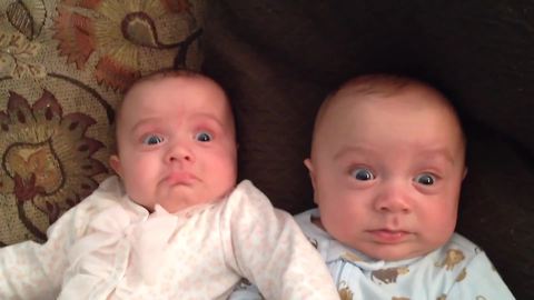 Twin Babies Eyes Go Wide When Their Mom Makes Trilling Noise