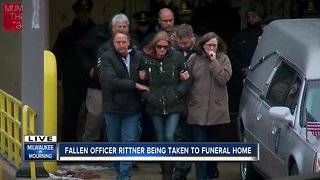 Fallen officer Rittner's wife escorted