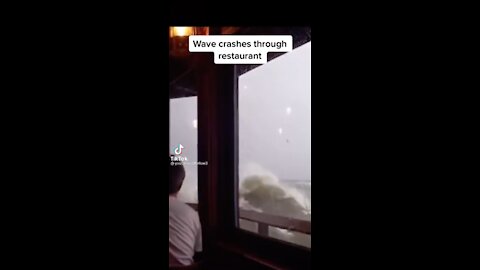 Massive wave interrupts lunch and breaks through glass in restaurant