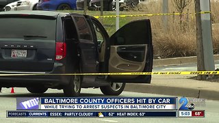 Two Baltimore County officers hit by car while trying to arrest suspect in city