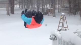 A Boy Flips Into Deep Snow