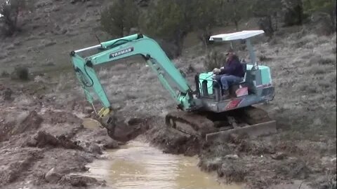 Yanmar Excavator Digging An Emergency Ditch