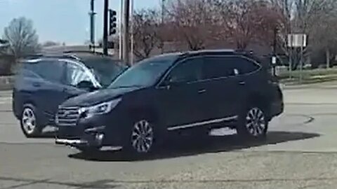 Driver of the SUV fails to yield when turning left at the intersection.