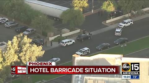 Police working barricade situation at hotel near I-17 and Peoria