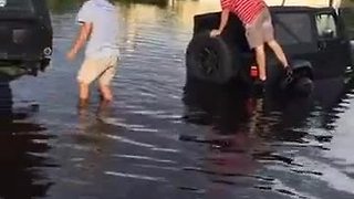 Cars getting towed out of flooded areas in Fort Myers on Island park Rd