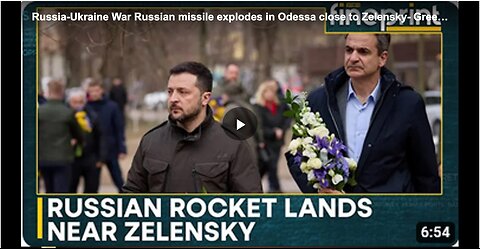 A Russian rocket landing and exploding near Ukrainian President Volodymyr Zelensky