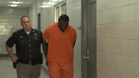 Suspects in 1-year-old's death walk to first court hearing