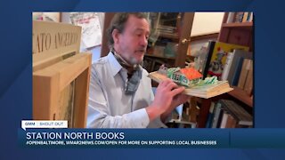 Station North Books in Baltimore says "We're Open Baltimore!"