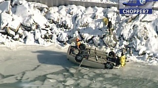 Man rescued from car after it flips onto ice