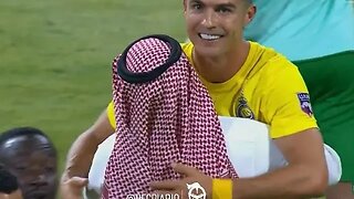 Cristiano Ronaldo hugs the president of Al Nasr after he helped his team win the Arab Cup
