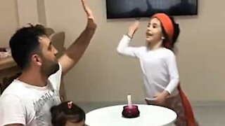 Dad helps daughter with her magic tricks without her knowing