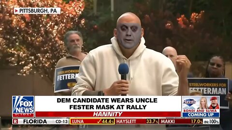 DEM CANDIDATE WEARS UNCLE FESTER MASK AT RALLY