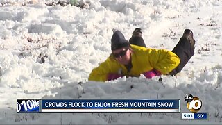 Locals head to mountains to experience snow