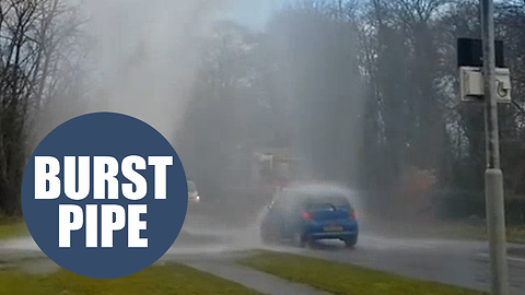 Dramatic video shows cars battered by water erupting from burst pipe