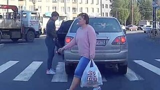 Man walks through car that's blocking zebra crossing