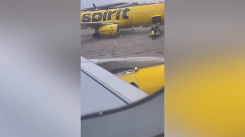 Worker taping Spirit Airlines plane wing goes viral as social media baffled