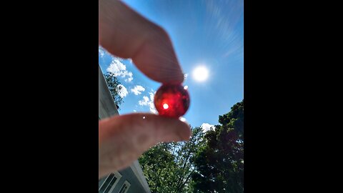 Blood Red Marble and Quarter share Hole