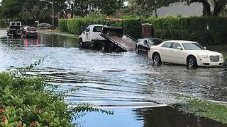 Who is responsible for flooded street?