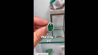 Custom oval cut dark vivid green oval emerald and VS diamond halo platinum engagement ring