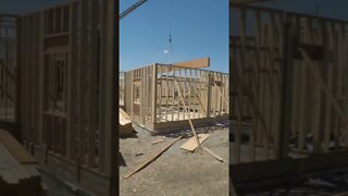 Lifting our huge 24” deep x 27’ long beam into place! #TektonHomeConstruction #DIYHomeBuild