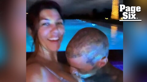 Travis Barker buries face in Kourtney Kardashian's chest in sexy bikini snap