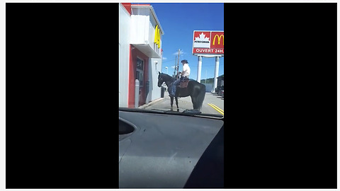 Man on horse struggles at McDonald's drive-thru