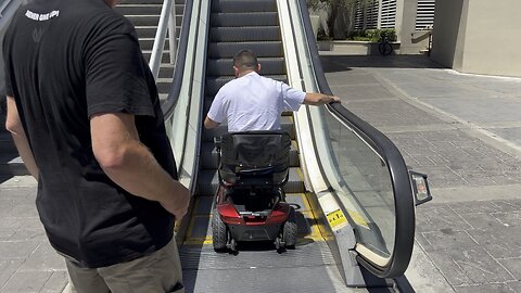 Las Vegas tourists drive scooters up escalator