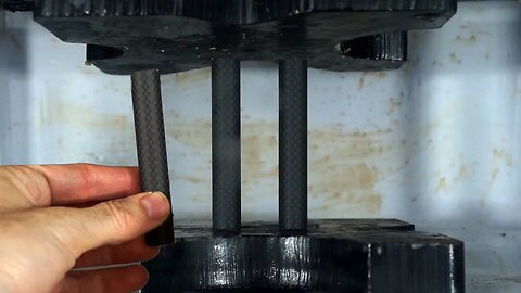 Carbon Composite Fiber Tubes Crushed In Hydraulic Press