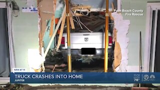 Truck crashes into home in Jupiter