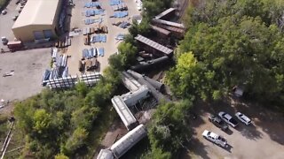 VIDEO: Train derails with more than a dozen cars off tracks in Warren; several roads closed