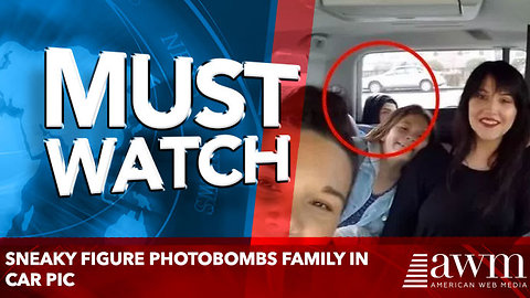 Sneaky Figure Photobombs Family in Car Pic