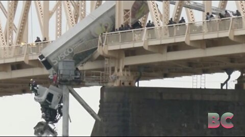 Semi removed after dangling off Louisville bridge for several hours, driver rescued from cab