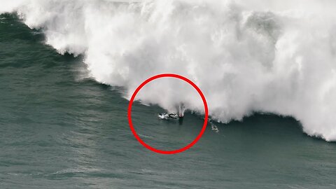 Surfer washed away by a huge wave