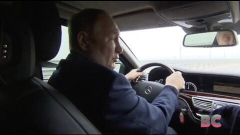 Vladimir Putin brazenly drives across repaired Crimea bridge after huge truck bomb