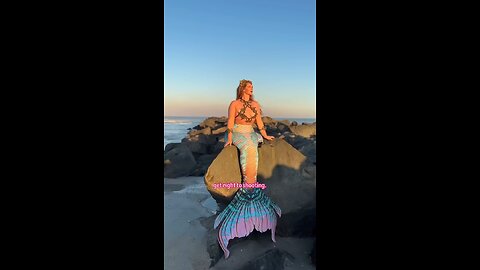 Mermaid girl on the rocks