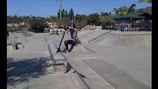 Twins at PQ Skatepark Having Fun Learning to Fly Out High on Scooters